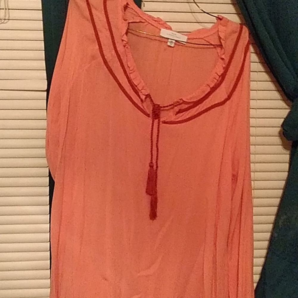 A peach woman's long sleeve shirt a size medium is a dress shirt nice